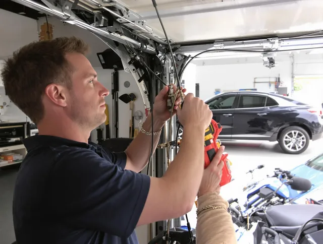 Madison Garage Door Repair safety certified technician performing cable replacement in Madison