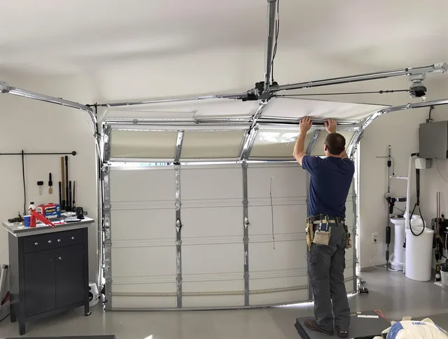 Madison Garage Door Repair specialist performing precise section replacement on Madison garage door